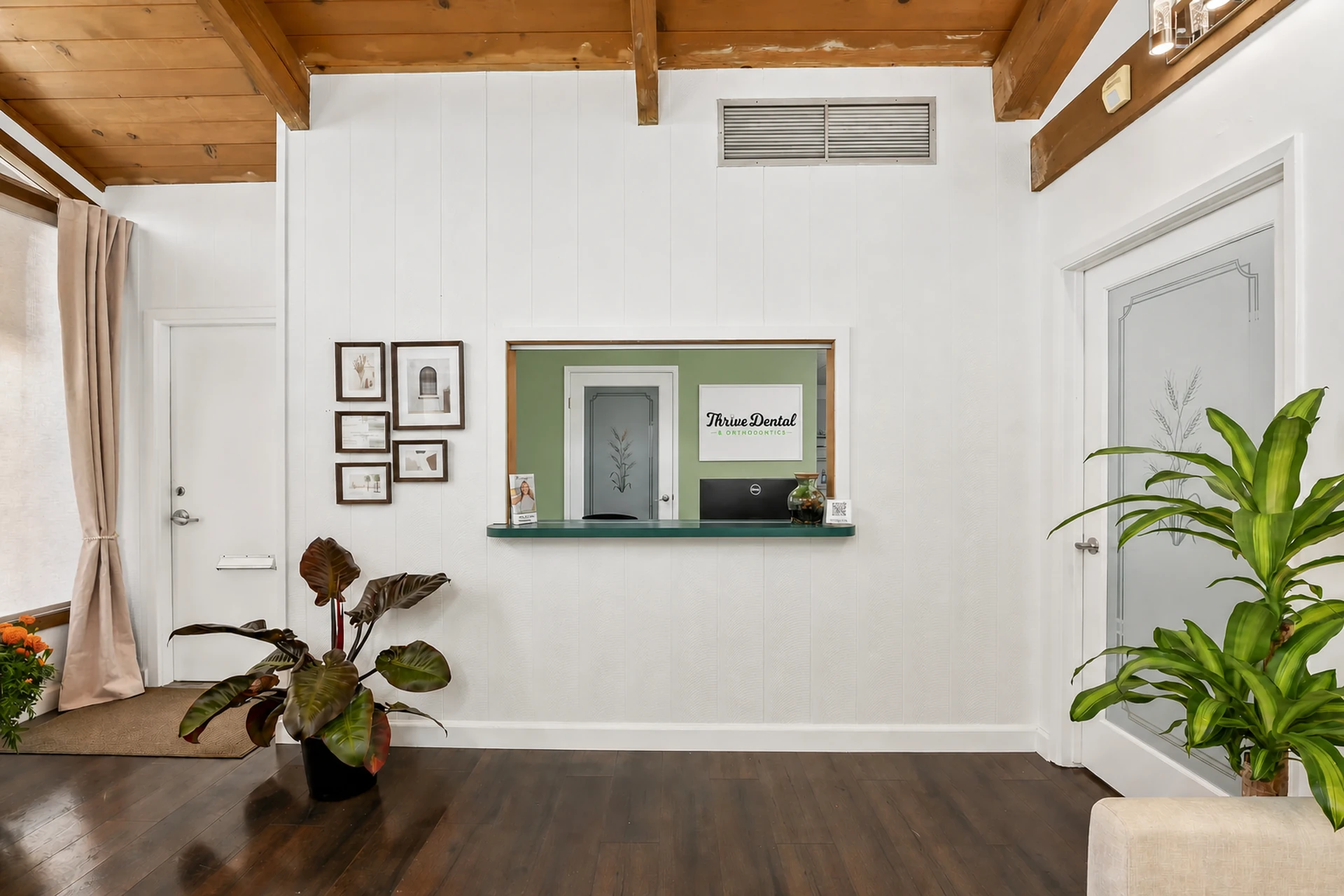 Welcoming interior with vaulted wood ceiling and plants at Thrive Dental Santa Clara